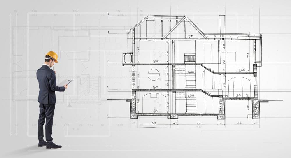 Architect watching a 2 dimension house plan